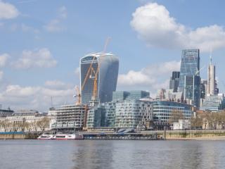 a view of london's skyline - The Monument to the Great Fire of London